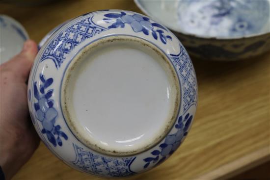 A 19th century Chinese blue and white punch bowl, Diameter 35cm. and three other bowls (a.f.)